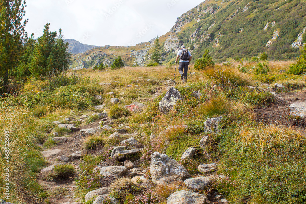 man trekking in the mountains, Alps in Austria, Steiermark man trekking in the mountains, Alps in Austria, Steiermark