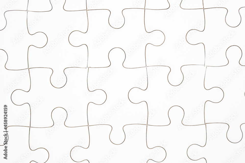 white jigsaw puzzle piece, top view shot.