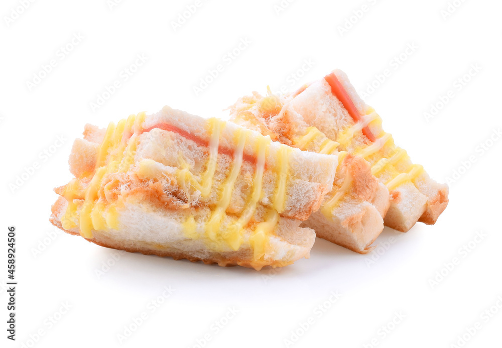 Sandwich with ham, cheese, tomatoes, lettuce, and toasted bread. Top view isolated on white background.