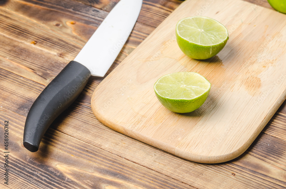 Sliced limes with a white bladed knife. Sliced limes with a white bladed knife.