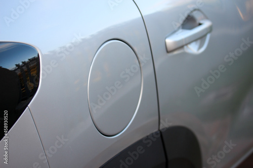 Closed round fuel filler cap of a new silver vehicle