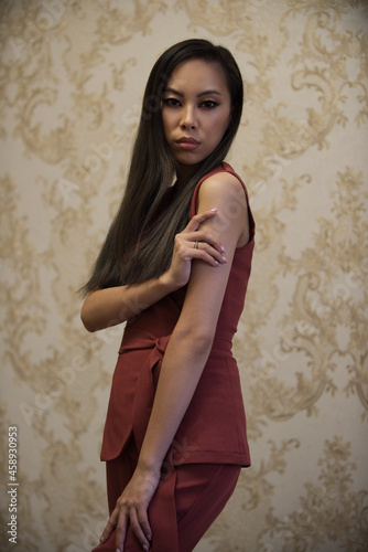Asian woman in a red costume