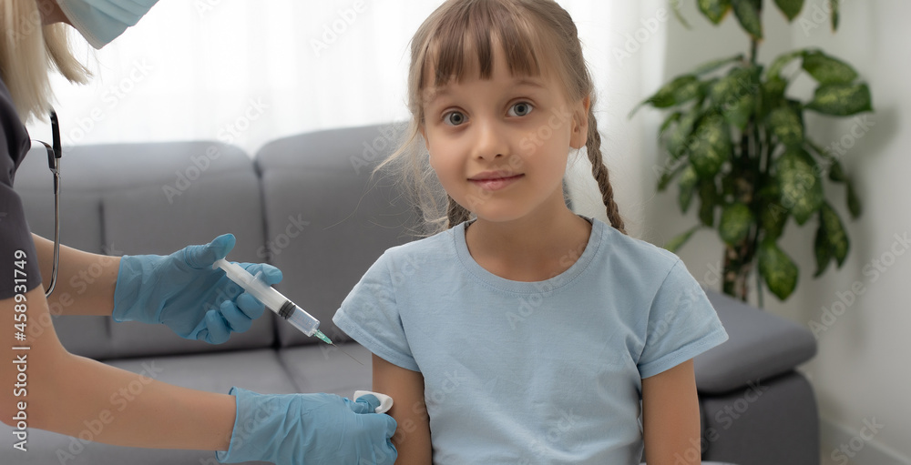 nurse giving vaccination injection to little girl patient nurse giving vaccination injection to little girl patient