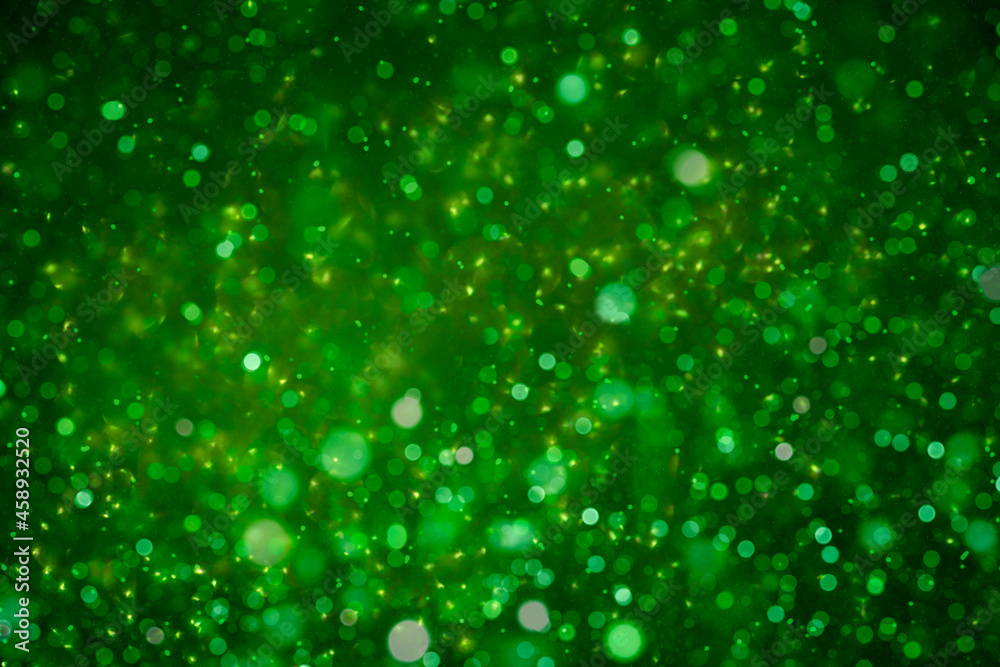 christmas glitter green background with bokeh