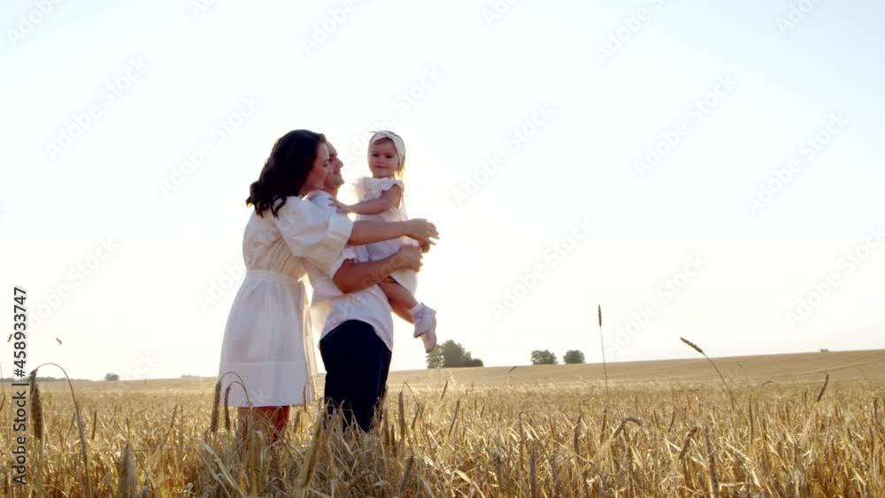 Loving care, family hugs, funny game together of happy mother, father, daughter Loving care, family hugs, funny game together of happy mother, father, daughter