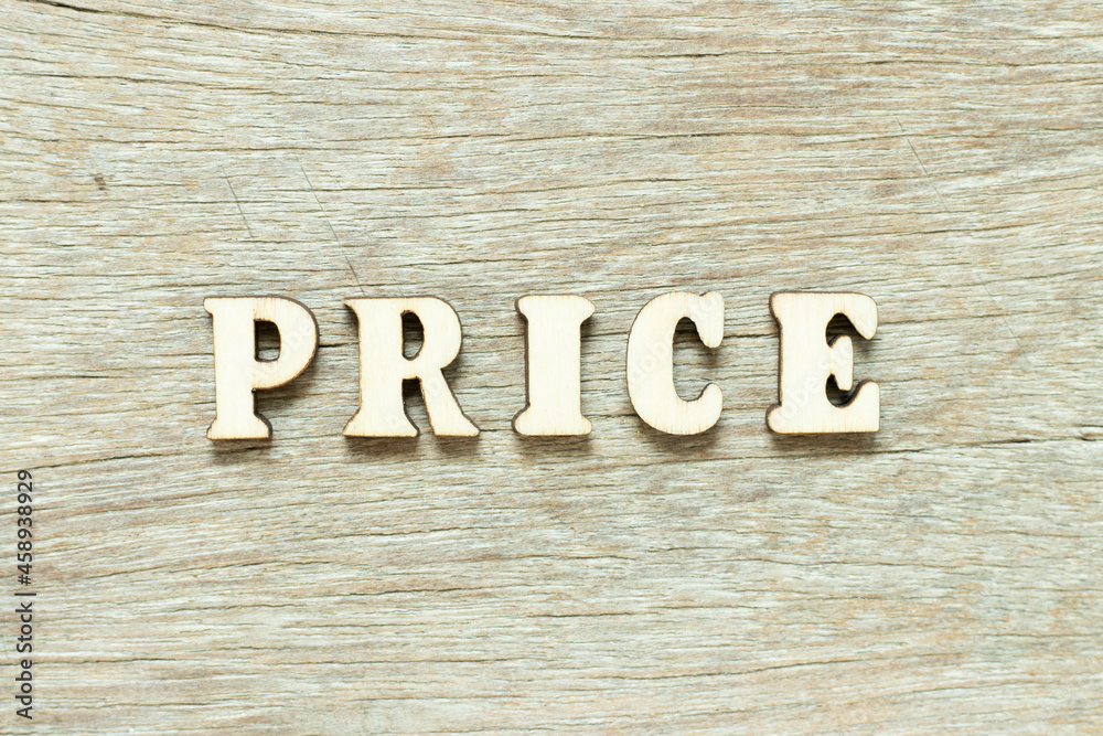 Alphabet letter in word price on wood background Alphabet letter in word price on wood background
