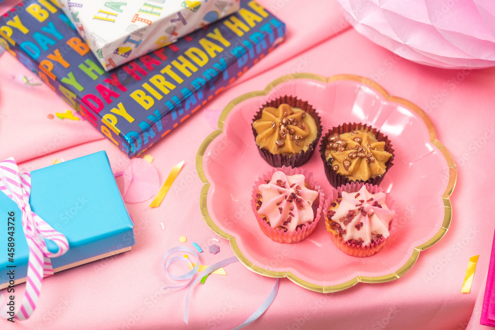 Birthday party table, with pink tablecloth Birthday party table, with pink tablecloth