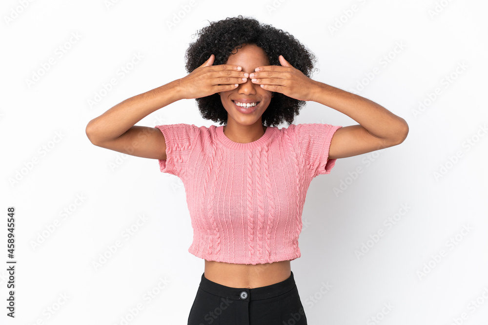 Young African American woman isolated on white background covering eyes by hands and smiling Young African American woman isolated on white background covering eyes by hands and smiling