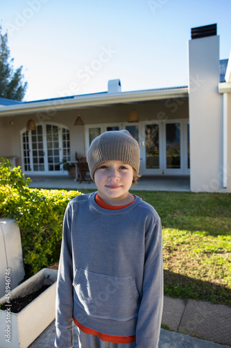 Portrait of a boy wearing a woolly hat.