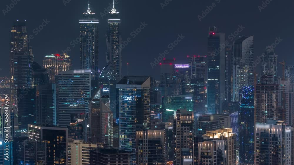 Skyline with modern architecture of Dubai business bay towers night timelapse. Aerial view Skyline with modern architecture of Dubai business bay towers night timelapse. Aerial view