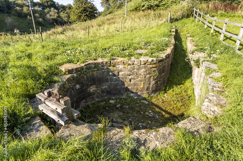 The restored 19th century stone built sheepwash in the Cotswold village of Cutsdean, Gloucestershire UK photo