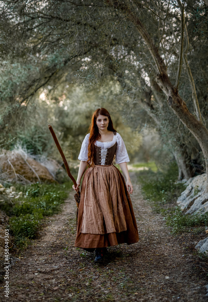 Witch with broomstick in forest Witch with broomstick in forest