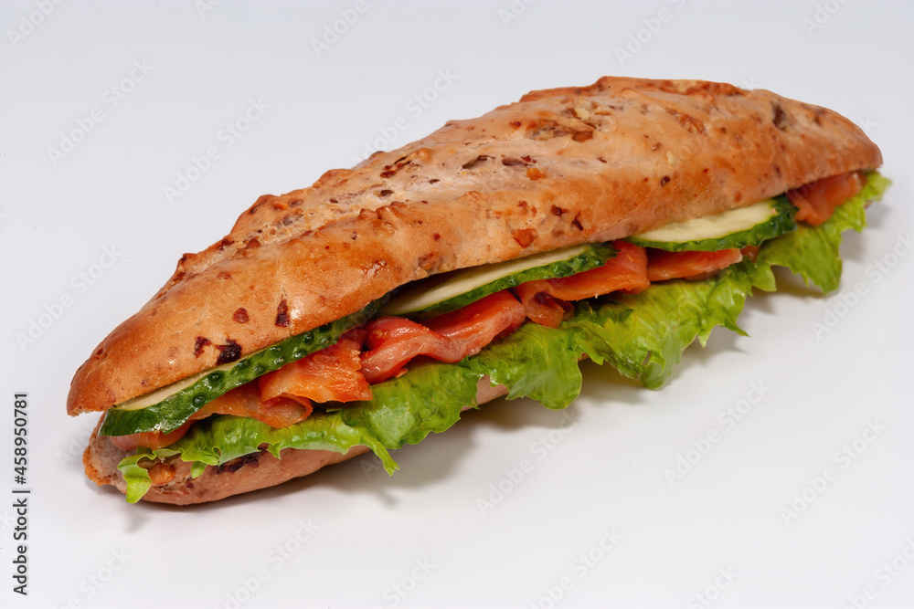 Sandwich with smoked and salted salmon for healthy breakfast isolated on white background