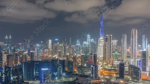 Wallpaper Mural Panoramic skyline of Dubai with business bay and downtown district night timelapse. Torontodigital.ca