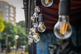 Decorative retro light bulbs for decoration in outdoor cafe. Selective  focus.