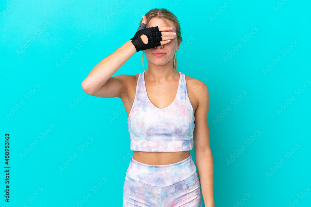 Sport caucasian woman isolated on blue background covering eyes by hands. Do not want to see something Sport caucasian woman isolated on blue background covering eyes by hands. Do not want to see something