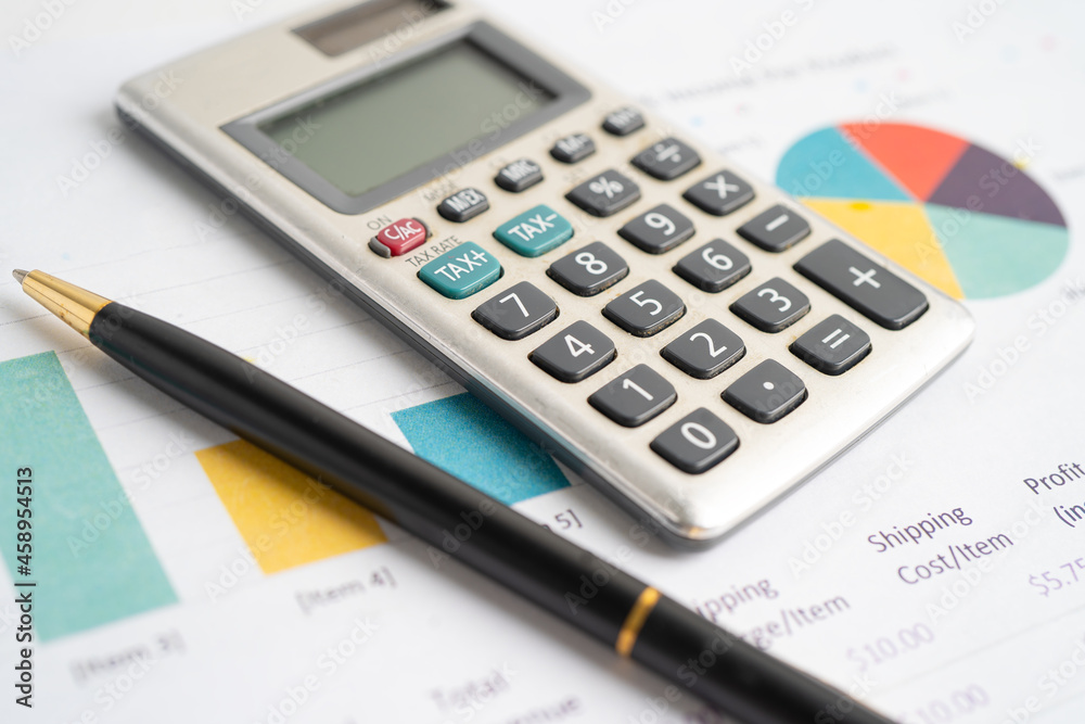 Calculator on graph paper. Finance development, Banking Account, Statistics, Investment Analytic research data economy, Stock exchange trading, Business company concept. Calculator on graph paper. Finance development, Banking Account, Statistics, Investment Analytic research data economy, Stock exchange trading, Business company concept.