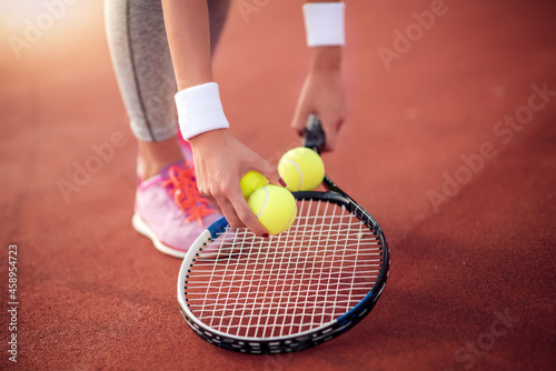 Tennis player with balls and racket © ivanko80