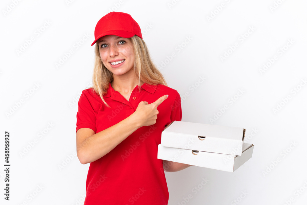 Delivery woman holding pizzas isolated on white background pointing back Delivery woman holding pizzas isolated on white background pointing back