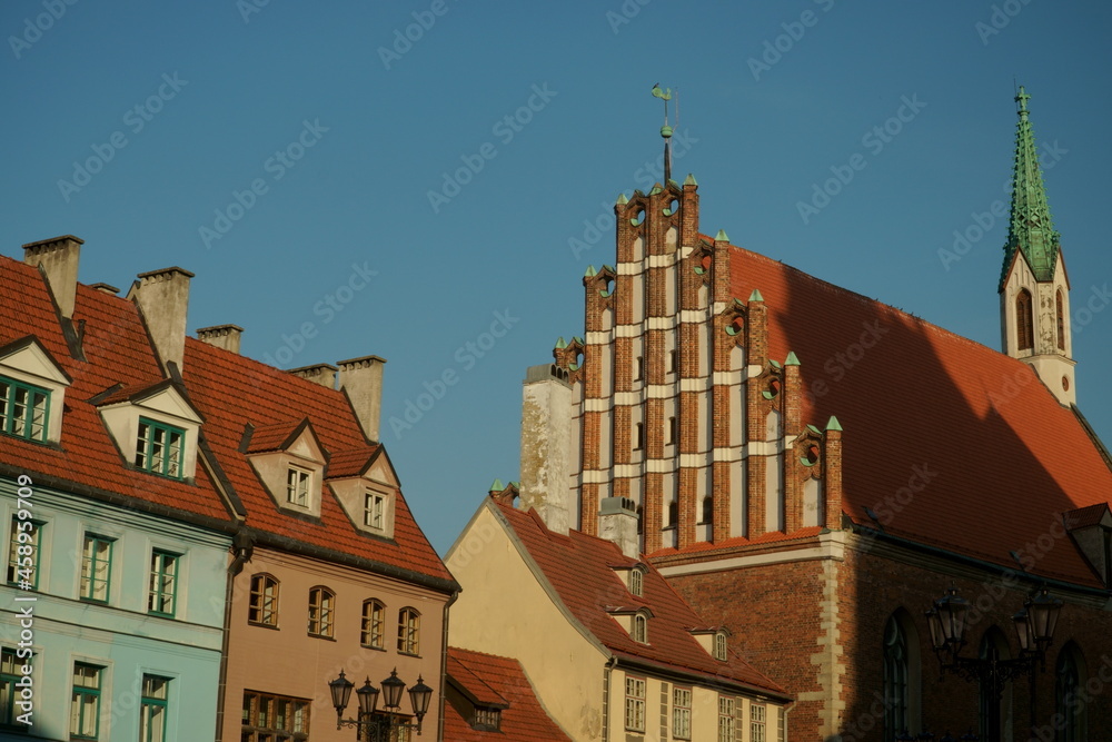 Old town landscape with the view to colorful building facades and tiled roofs in the historical center of the Riga city, Latvia on a sunny day. Travel to the Latvian capital.