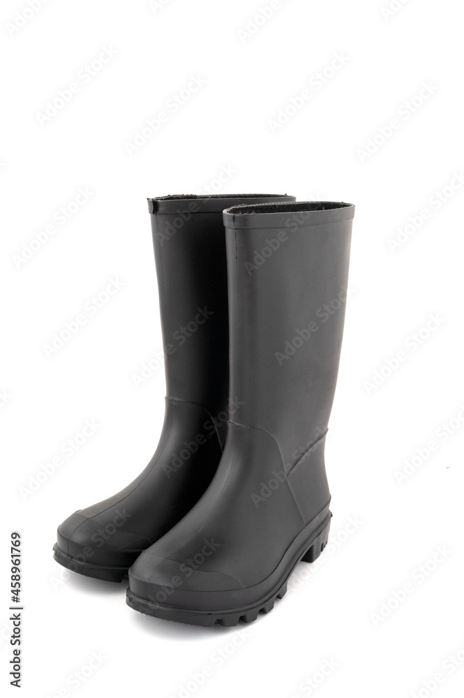 Pair of black high rubber boots, rain boots isolated on white Pair of black high rubber boots, rain boots isolated on white
