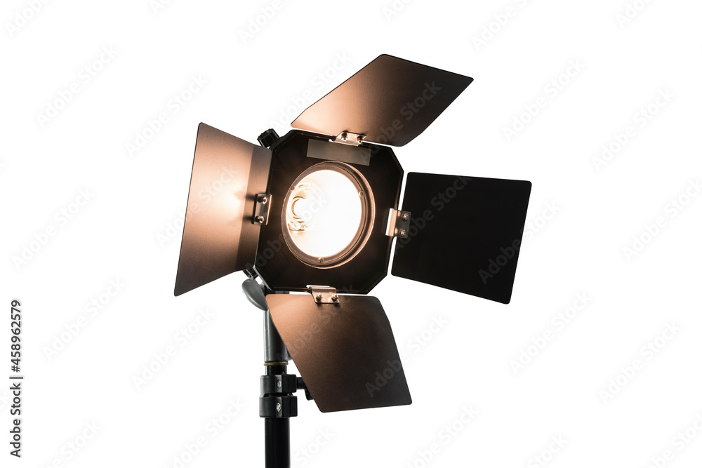Bright studio light with barn doors isolated on white. Bright studio light with barn doors isolated on white.