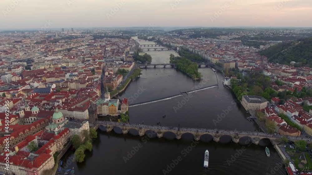 Obraz premium Flying over Vltava river with Charles Bridge in Prague