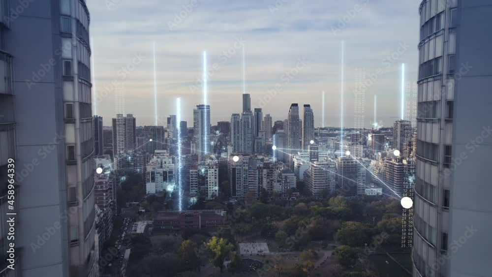 Future concept with glowing digital lines connecting city - Cinematic drone flight between twin skyscraper buildings in Buenos Aires - Modern skyline with high tech data communication -5g 6g network
