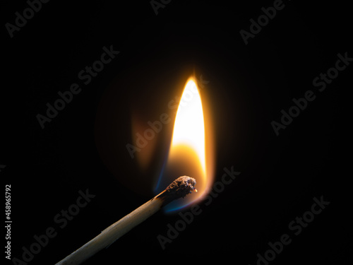 burning match on black background