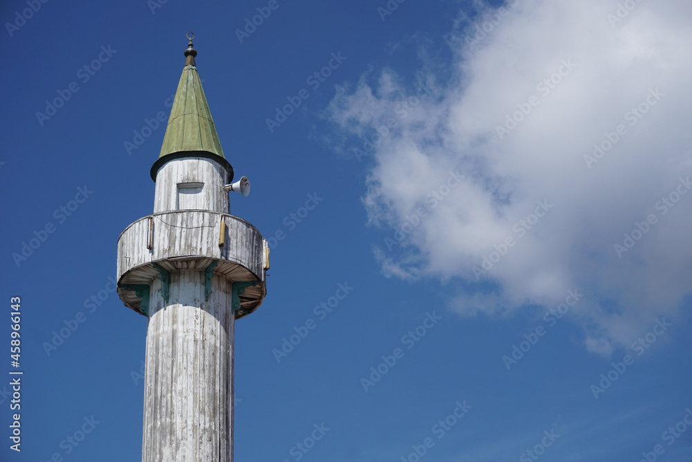 white wooden mosque minaret