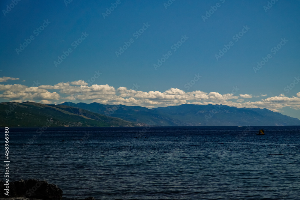 mountain coast, clouds over the mountains, the evening sea, the Adriatic Sea 