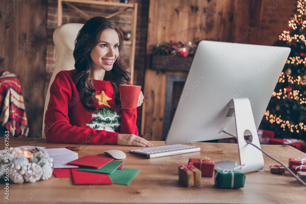 Fototapeta premium Photo of charming sweet young woman dressed print pullover talking modern device drinking tea smiling indoors room home house