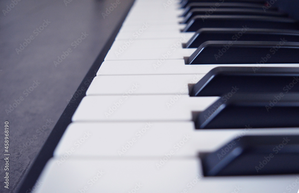 Digital Piano Keyboard - Photo of a musical instrument, closeup with white and black keys Digital Piano Keyboard - Photo of a musical instrument, closeup with white and black keys