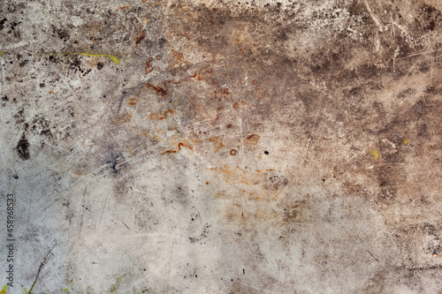 Background image of a grunge texture in gray-brown tones. Abstract background with stains of rust, dirt and paint.