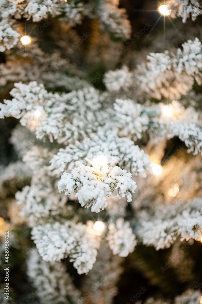 branches of a Christmas tree with garlands branches of a Christmas tree with garlands