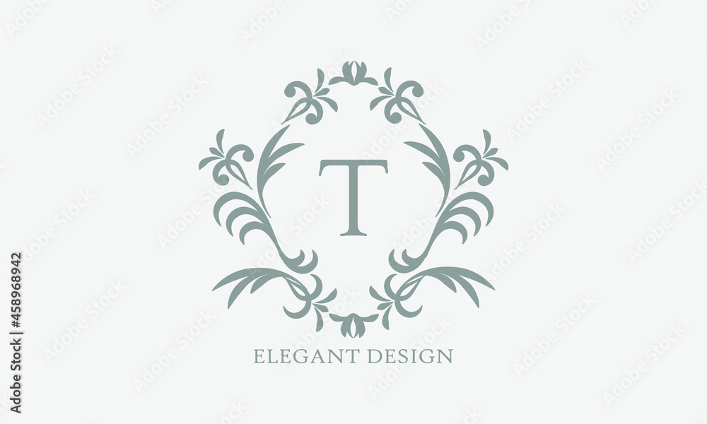Exquisite design of an elegant monogram with the letter T in the center in gray. Logo for boutiques, cafes, bars, restaurants, invitations. Business style and brand of the company Exquisite design of an elegant monogram with the letter T in the center in gray. Logo for boutiques, cafes, bars, restaurants, invitations. Business style and brand of the company