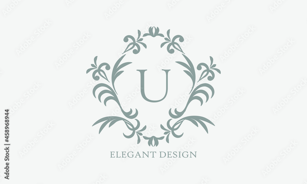 Exquisite design of an elegant monogram with the letter U in the center in gray. Logo for boutiques, cafes, bars, restaurants, invitations. Business style and brand of the company