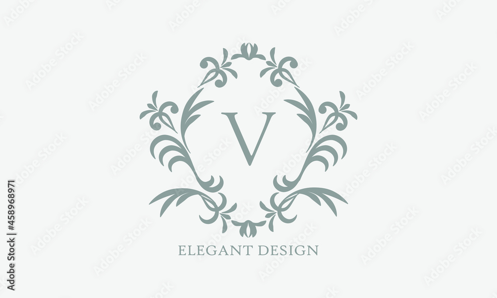 Exquisite design of an elegant monogram with the letter V in the center in gray. Logo for boutiques, cafes, bars, restaurants, invitations. Business style and brand of the company Exquisite design of an elegant monogram with the letter V in the center in gray. Logo for boutiques, cafes, bars, restaurants, invitations. Business style and brand of the company