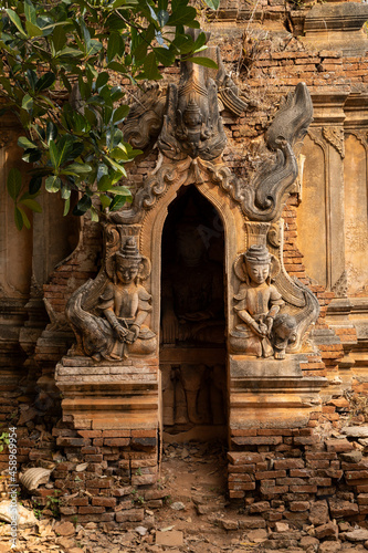 Buddhist figures and reliefs in one of the ancient red brick stupas and pagodas, in Nyaung Ohak, Shwe Indein Pagoda, Shan State, Myanmar