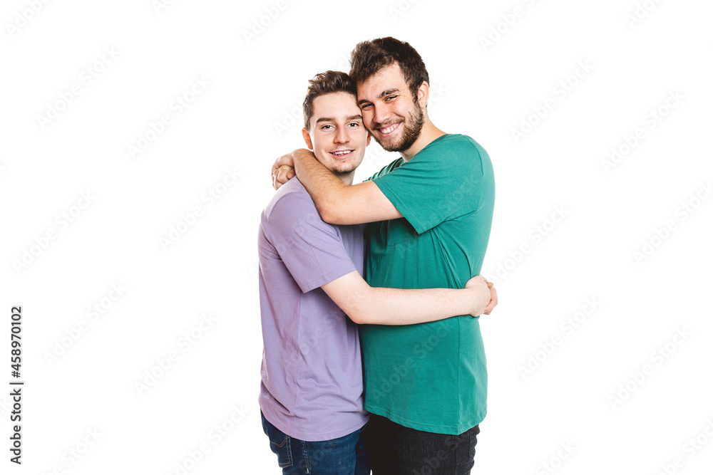 Young gay couple standing together over isolated background Young gay couple standing together over isolated background