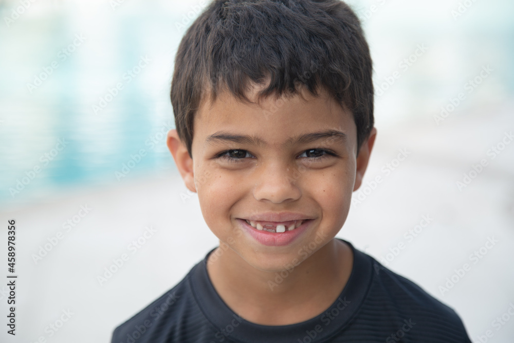 young child with loose tooth and missing tooth 