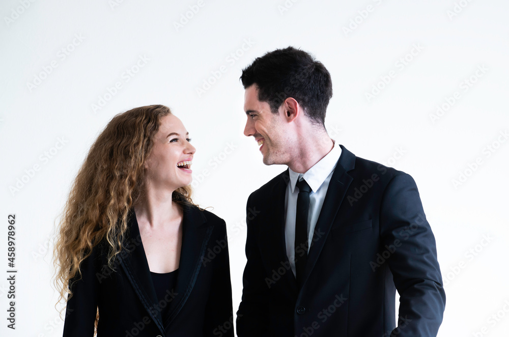 Portrait of young man and woman wearing suit talking and smilling isolated on white. Coworkers. Business people collaboration teamwork concept. People business people talking for business project. Portrait of young man and woman wearing suit talking and smilling isolated on white. Coworkers. Business people collaboration teamwork concept. People business people talking for business project.