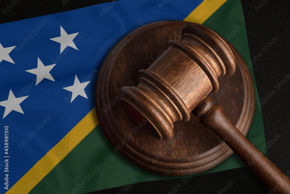 Judge Gavel and flag of Solomon Islands. Law and justice in Solomon Islands. Violation of rights and freedoms