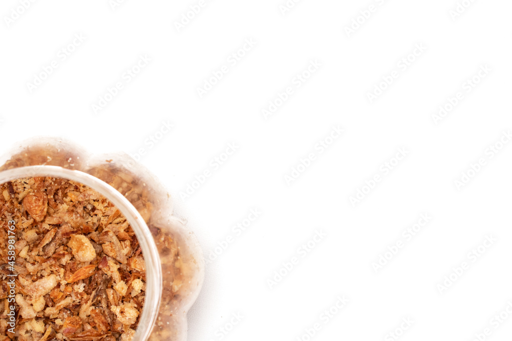 fried onions in a jar on a white background