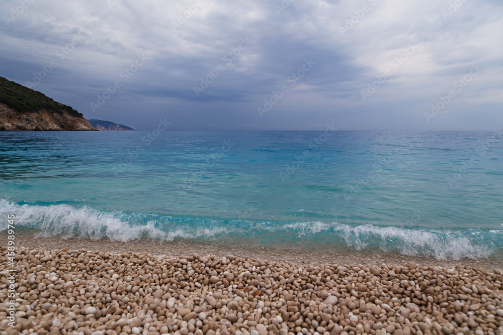 Dark stormy dramatic sky over Ionian sea. Myrtos Beach, Cephalonia island, Greece, Europe.