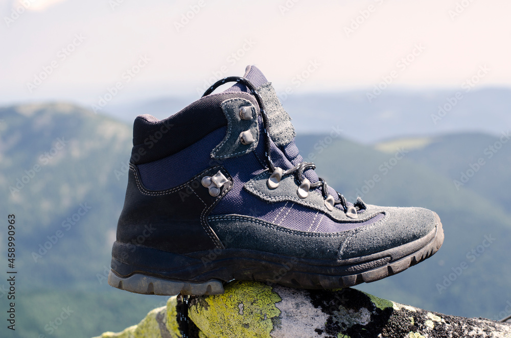 Trekking shoes sneakers. Against the background of the mountains. Hiking in the mountains. Trekking shoes sneakers. Against the background of the mountains. Hiking in the mountains.