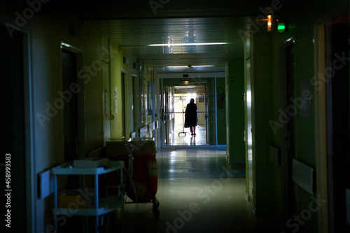 Patient in hospital corridor.