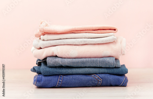 a stack of children's clothes for a girl. Jeans, tshirt