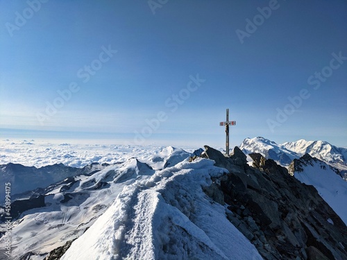 Summit cross on the Dom highest mountain in Switzerland, Mountaineering in the valais alps, Fantastic view Dom 4545