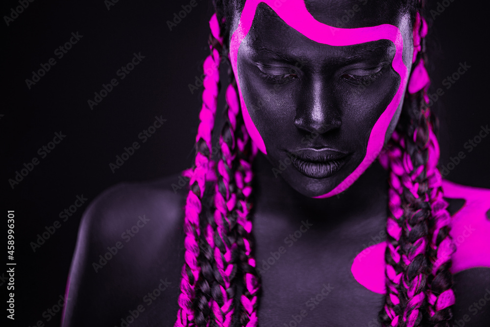 Neon colors. Pink and black body paint. Woman with face art. Young girl with colorful bodypaint. An amazing afro american model with makeup. Neon colors. Pink and black body paint. Woman with face art. Young girl with colorful bodypaint. An amazing afro american model with makeup.